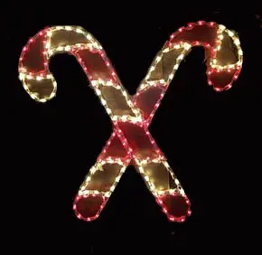 Illuminated candy canes on black background