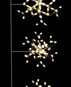 Snowflake-shaped string lights on black background