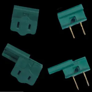Multiple green plug adapters displayed