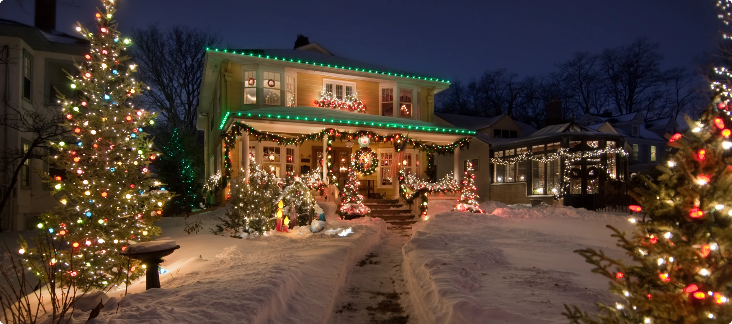 Illuminated home during winter holiday season